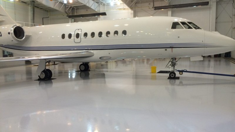 Jet aircraft on a ProREZ-coated hangar floor demonstrating durability under heavy loads