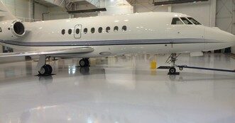 Jet aircraft on a ProREZ-coated hangar floor demonstrating durability under heavy loads